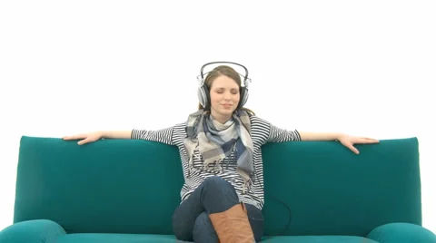 Girl Relaxing On The Couch With Music
