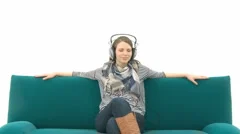 Girl Relaxing On The Couch With Music