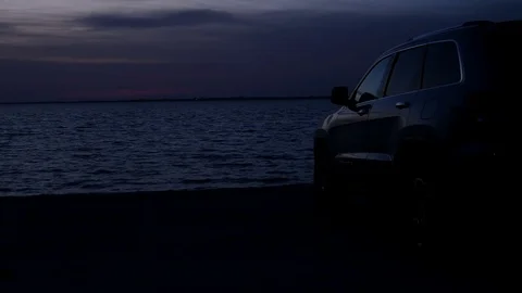 Silhouette Of A Car At Sunset