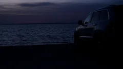 Silhouette Of A Car At Sunset