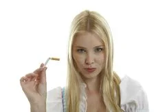 Woman Breaks Cigarette In Two Pieces