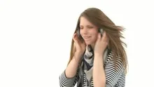 Beautiful woman listening to music with headphones