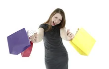 Excited shopping woman shouting with shopping bags