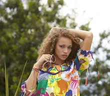 Beautiful woman with curly hair and sunglasses