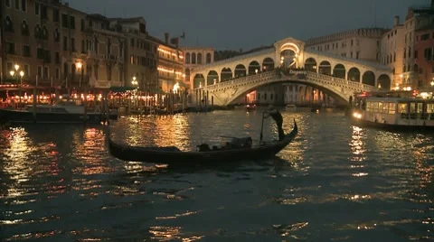 Gondola In Front Of Rialto Bridge In Venice