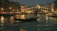 Gondola In Front Of Rialto Bridge In Venice