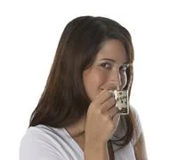 Woman Enjoys A Cup Of Espresso