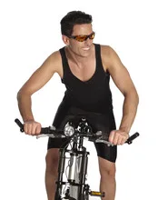 Portrait of a young man in uniform on a bycicle