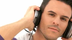Pan Shot Zoom Out Man Enjoys Music On His Earphones