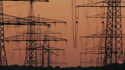 Sunset Wind Turbine And Power Lines