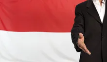 Open hand and Indonesia flag in the background