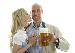 Woman In Dirndl And Man With Beer Mug