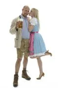 Woman In Dirndl And Man In Leather Trousers 