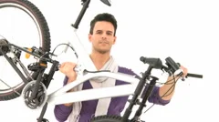 Man Lifts Bicycle