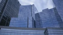 Time lapse glass skyscrapers zoom out