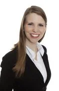 Portrait Of A Smiling Young Businesswoman On White Background