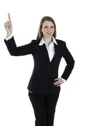 Business Woman Points At Something On The Top Of The Image. Isolated On White
