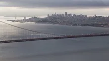 Time lapse sunrise close up pan shot Golden Gate Bridge