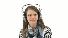 Beautiful woman listening to music with headphones