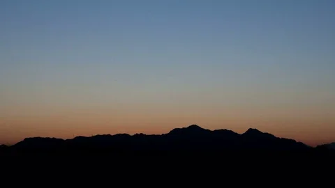 Sunrise 4K Time Lapse At Mountain Range Zoom Out