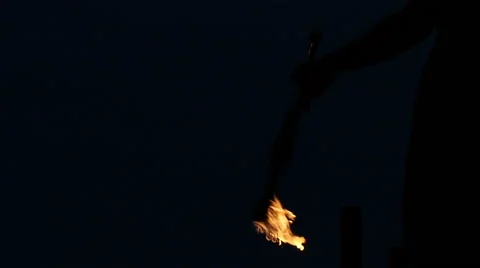 Slowmotion Fire Sticks Juggler Performing