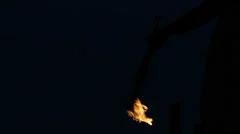 Slowmotion Fire Sticks Juggler Performing