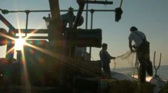 Two Fishers On A Fishing Boat