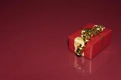 Red Gift Reflects In Glass