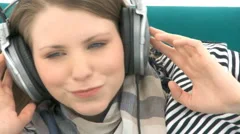Close Up Woman Listens To Music With Headphones