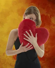 Woman with heart pillow
