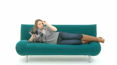 Woman Relaxes On Couch With Music