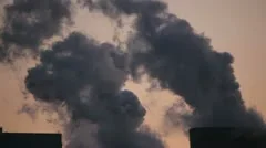 Cooling Tower With Steam At Sunset