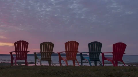 Time Lapse Close Up Pan Shot Red Sunrise Behind Chairs