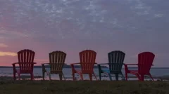 Time Lapse Close Up Pan Shot Red Sunrise Behind Chairs