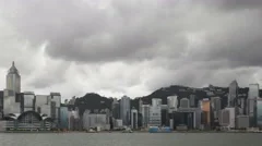 4K Time Lapse Zoom Out Hong Kong Skyline Dark Clouds