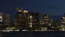 Time lapse close up pan shot slow Boston skyline at twilight