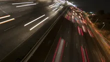 Time lapse rotate freeway light trails at night