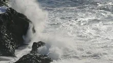 Slowmotion waves crashing on rock coast