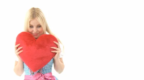 Woman Cuddling With Heart Pillow