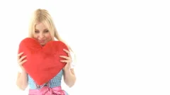 Woman Cuddling With Heart Pillow