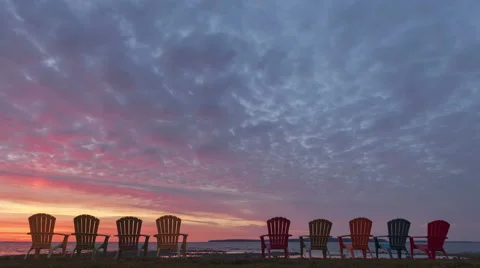 4K Time Lapse Zoom Out Red Sunrise Behind Chairs