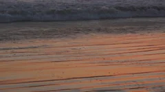 Tide Waves On The Beach At Sunset