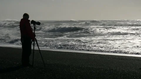 Blurred Photographer At Black Sand Beach
