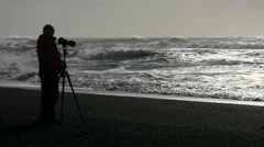 Blurred Photographer At Black Sand Beach