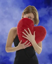 Woman with heart pillow