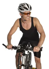 Portrait of a young man in uniform on a bycicle