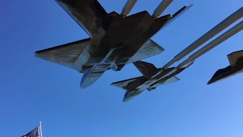 Us Flag In Slowmotion With Aircraft Silhouette