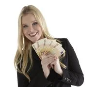 Confident Young Businesswoman Holding Currency Notes And Smiling