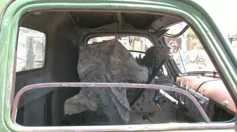 Dinosaur In An Old Car
