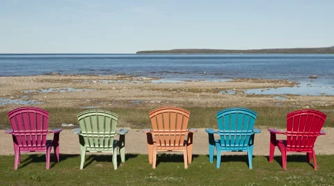 4K Time Lapse Shadow Over Colored Chairs At Lake